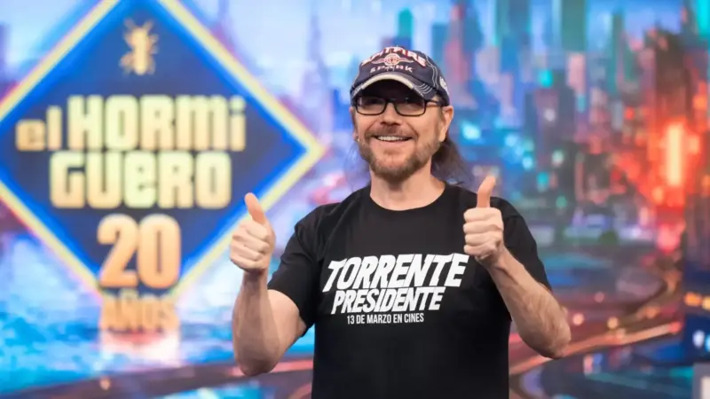 Santiago Segura holds Torrente character costume